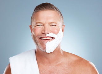 Image showing Shaving cream, portrait and happy old man in studio for skincare, grooming or beauty on grey background. Face, foam and hair removal for mature model smile for luxury, skin or beard product isolated