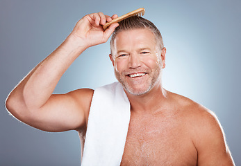 Image showing Senior man, portrait and comb for hair, brush and grooming in studio on gradient background. Face, hair care and brushing with mature male model relax with luxury, hygiene and beauty routine isolated