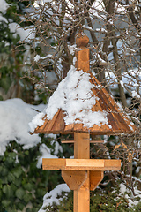Image showing simple birdhouse in winter garden