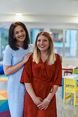 Image showing Portrait of a two teacher in a preschool institution, in the background of the classrooms