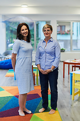 Image showing Portrait of a two teacher in a preschool institution, in the background of the classrooms