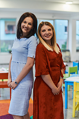 Image showing Portrait of a two teacher in a preschool institution, in the background of the classrooms