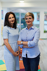 Image showing Portrait of a two teacher in a preschool institution, in the background of the classrooms