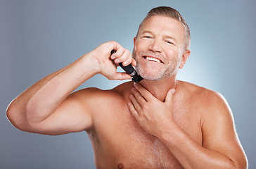 Image showing Grooming, skincare and portrait of man with razor for beard for wellness, facial and hygiene on blue background. Barber, cleaning and face of male with shaver for self care, healthy skin and haircare