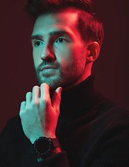 Image showing Idea, beauty and red with a handsome man model in studio on a dark background for contemporary fashion. Face, thinking and art with a young male posing indoor to promote trendy clothes or style