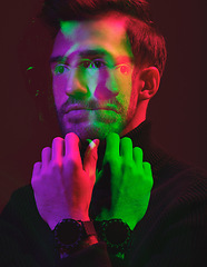 Image showing Thinking, neon double exposure and face of man isolated in dark studio for vision, leadership and idea. Fashion model, creative art aesthetic and confident male in elegant, classy and stylish clothes
