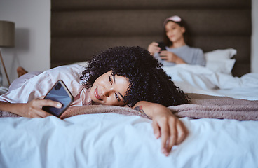 Image showing In love, phone and happy with black woman at sleepover for communication, internet and social media. Text, relax and smile with girl and friends in bedroom with technology, digital and online dating