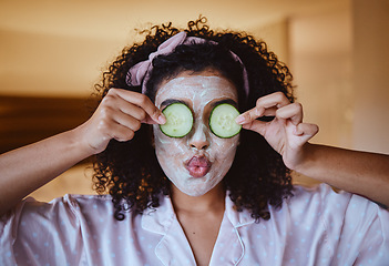 Image showing Cucumber, eyes and skincare facial for black woman in a bedroom, grooming and having fun with treatment. Face, mask and girl relax with fruit product, hygiene and beauty routine, happy and playful