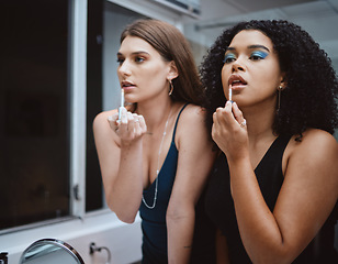 Image showing Women, friends and cosmetics at mirror in bathroom for beauty, wellness and makeup in night together. Black woman, girl and model with lipstick, dark aesthetic and support for cosmetic at party