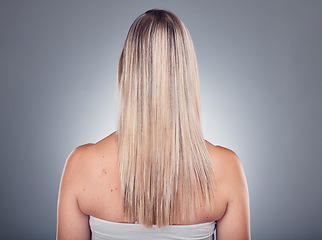 Image showing Grooming, beauty and woman with long blond hair due to salon care or cosmetic shampoo isolated in studio grey background. Treatment, balayage and girl with healthy shine and glow due to keratin