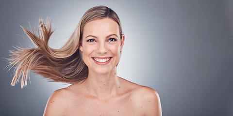 Image showing Woman in portrait, happiness and face with hair in air, beauty and keratin treatment, cosmetic care isolated on studio background. Mockup space, glow and hairstyle, natural cosmetics and skincare