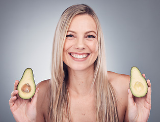 Image showing Beauty, skin or hair care avocado for woman portrait in studio with natural cosmetic and shampoo shine. Face of aesthetic model with fruit on grey background for hairdresser or sustainable product