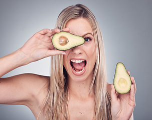 Image showing Beauty, avocado and skin care woman portrait in studio with natural glow and cosmetic shine. Comic face of aesthetic model excited on grey background for sustainable food or hair product benefits