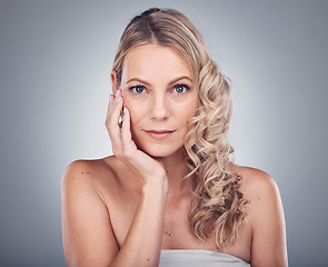 Image showing Woman, face and hair with portrait and hand, hairstyle and balayage with keratin treatment isolated on studio background. Beauty, skincare and natural cosmetics with wellness and healthy skin