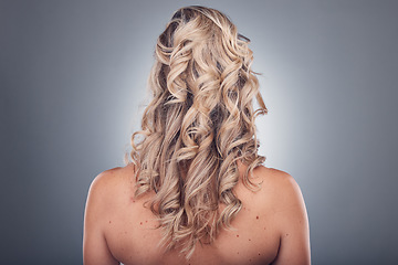 Image showing Hair care, beauty and woman with curly hairstyle texture after salon treatment in a studio. Gray background, isolated and model with hairdresser balayage, dye and growth from haircut and keratin