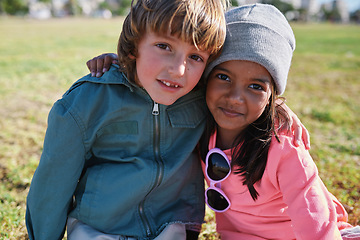 Image showing Friends, portrait and kids hug at park while bonding, smile and having fun together outdoors. Diversity, care and children hugging, cuddle and embrace while enjoying quality time on holiday vacation.