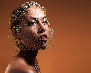 Image showing Net veil, elegance and face of a woman with fashion idea isolated on a brown studio background. Thinking, makeup and stylish vintage model with a fancy, retro and glamour accessory with mockup space