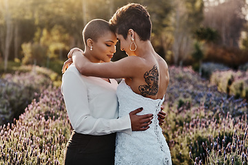 Image showing Married couple, lesbian and hug in embrace for LGBT, gay or transgender relationship in the nature outdoors. Happy women hugging for wedding, marriage or commitment in support for sexuality together