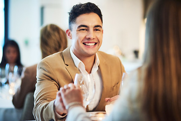 Image showing Romance, love and couple on a date at restaurant holding hands for connection, unity and care. Happy, smile and man showing his girlfriend affection while at dinner for valentines day or anniversary.