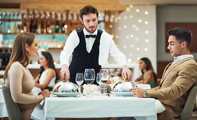 Image showing Restaurant, food and valentines day with a couple at a table in celebration of love, romance or marriage together. Wine, night or luxury fine dining with a man and woman celebrating their anniversary