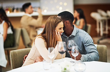 Image showing Love, man whisper with woman and in restaurant with wine glasses, happiness or cheerful on Valentines day. Romance, couple or flirty for quality time, romantic or conversation with fine dining or joy