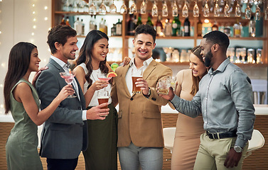 Image showing Group, friends and toast for celebration, party and happiness together, smile and bonding. Young people, diversity and team in restaurant, cheers and alcohol for event, congrats or success with smile