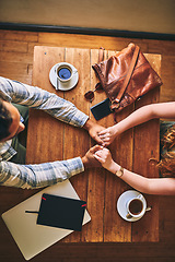 Image showing Top view, couple and coffee shop with holding hands, love and conversation for romance at table. Man, woman and valentines date in cafe for support, bonding and talking with happiness, care and trust