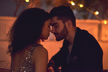 Image showing Love, passion and interracial couple on a date at a restaurant for nightlife, valentines day and city bonding. Care, embrace and man and woman with gratitude, calm and romance in Italy at night