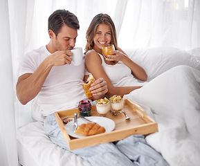 Image showing Breakfast, bed and couple portrait with love, care and morning food together at home. Happiness, smile and relax young people eating and drinking in a house for anniversary or valentines day