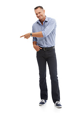 Image showing Portrait, pointing and mockup with a man in studio isolated on a white background for branding or product placement. Point, mock up and advertising with a male on blank space to point at a brand