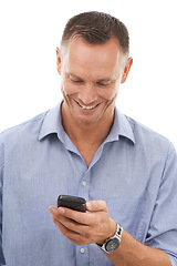 Image showing Typing, business man and phone in studio isolated on a white background for social media. Technology, smartphone and mature male entrepreneur happy with cellphone for networking or text messaging.