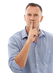 Image showing Secret, quiet and portrait of a man in a studio with a silence, hush or whisper face expression. Person, handsome and mature male model with a finger on his mouth gesture isolated by white background