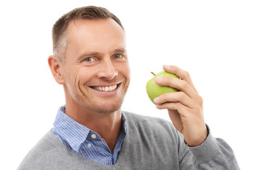 Image showing Man, studio portrait and eating apple fruit for health, diet and wellness isolated on a white background. Model person with nutrition vegan food for a healthy lifestyle, motivation and happiness