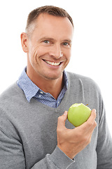 Image showing Healthy apple, studio portrait and man with fruit for health, diet and wellness isolated on a white background. Happy person with vegan nutrition food for green lifestyle, motivation and clean eating