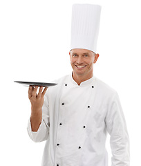 Image showing Portrait of chef, empty tray and smile, presenting menu special promo deal or restaurant product placement. Happy cafe, cook and man in uniform with mock up isolated on white background in studio.