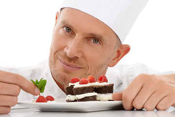 Image showing Fruit, baking and portrait of a chef with cake presentation isolated on a white background in a studio. Smile, food and face of a professional baker with a sweet chocolate dessert for catering