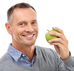 Image showing Man, apple and happy studio portrait with fruit for health, diet and wellness isolated on a white background. Model person smile for vegan nutrition food for healthy lifestyle, motivation and eating