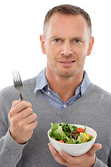 Image showing Man, salad and vegetables studio portrait with disgust for healthy food with nutrition for health. Model person with vegan lunch or brunch bowl isolated on a white background with a fork for wellnes