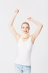 Image showing Happy, neck brace and portrait of a woman with freedom isolated on a white background. Smile, excited and girl with arms up for accident insurance, healthcare and medical attention with whiplash