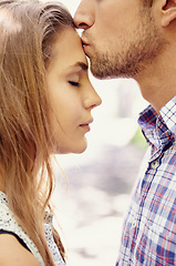 Image showing Love, couple and forehead kiss, park and happiness for relationship, dating and quality time outdoor. Romance, man and woman with affection, loving or bonding with romantic gesture or kissing on head