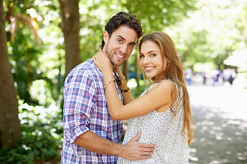 Image showing Couple hug, bonding and portrait on love date, valentines day or romance in nature park or relax garden. Smile, happy or embrace for woman and man in girlfriend trust, security and honeymoon support