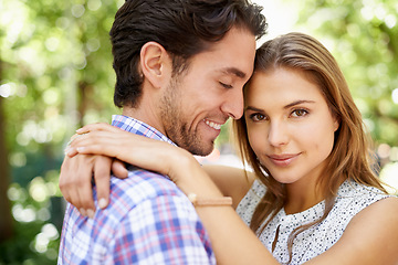 Image showing Couple portrait, hug or bonding in park, nature or garden on valentines day date, romance love or holiday. Smile, happy man or woman in embrace, relax trust or partnership support for profile picture