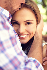 Image showing Happy couple, hug woman and portrait in park closeup on valentines date, love and romance with smile. Man, kiss and outdoor embrace for dating, romantic adventure and bonding with care in sunshine