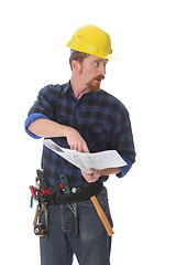 Image showing construction worker pointing on architectural plans