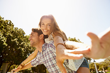 Image showing Bonding couple, piggy back or airplane in nature park, garden or backyard for valentines day, relax date or romance love. Smile, happy or man carrying woman in aeroplane, fun game or freedom activity