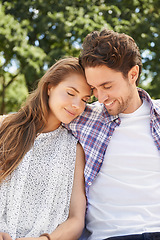 Image showing Happy couple, hug and emotion on love date, valentines day or nature park romance in relax garden bonding. Smile, happy and embrace for woman and man in trust, marriage security and honeymoon support