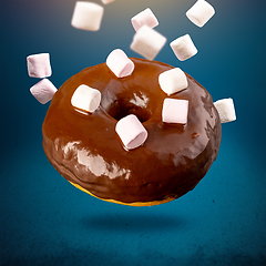 Image showing Flying chocolate glazed doughnut