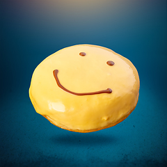 Image showing Flying smile face doughnut