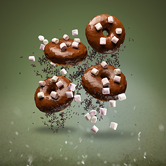 Image showing Flying chocolate glazed doughnuts