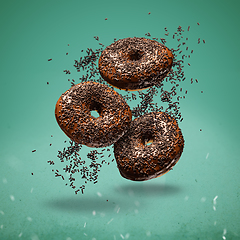 Image showing Sweet chocolate doughnuts, flying